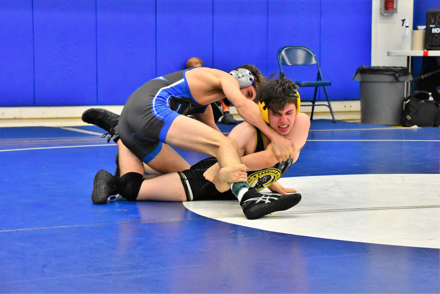 Cabrillo's Raymond Guerra (Right) struggles to escape from Lompoc's Gracen Hayes